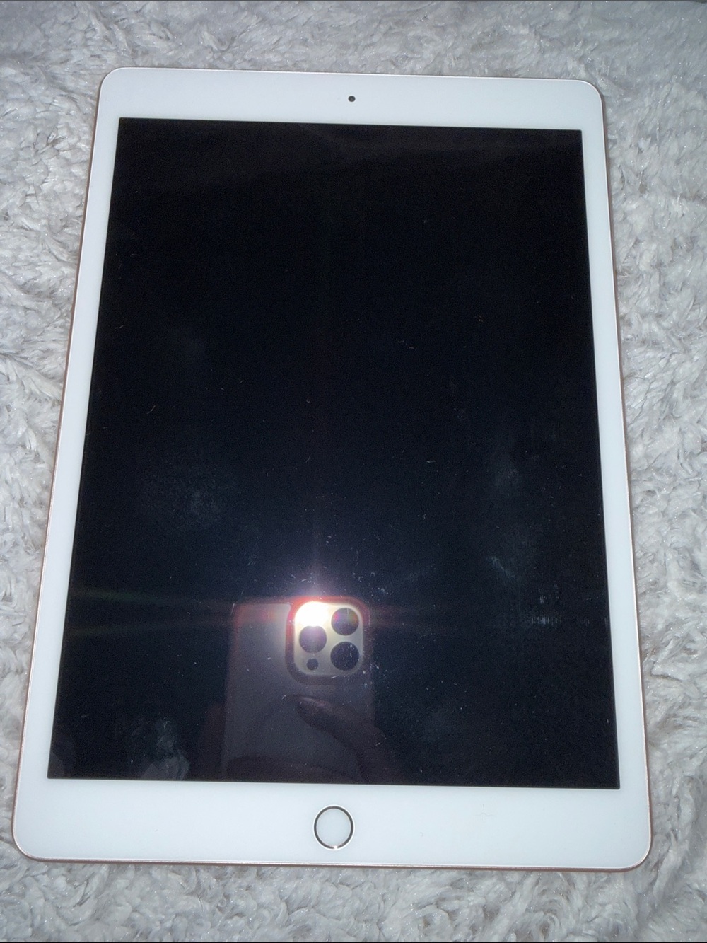 Apple Tablet with White Bezel and Black Screen